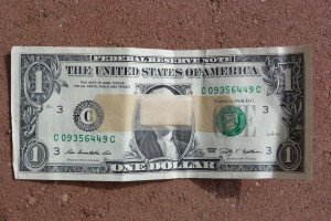 dollar bill with a band-aid