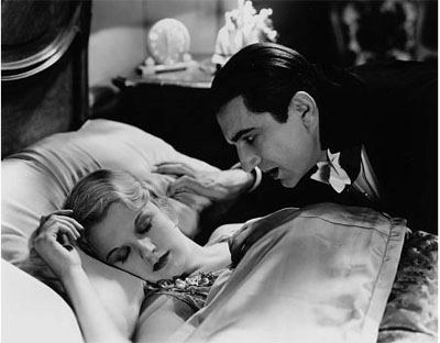 Bela Lugosi bites a victim in Dracula.