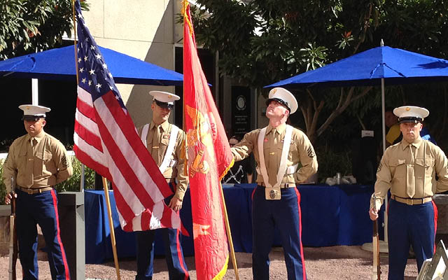 Flag ceremony featuring a military color guard