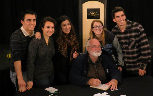 Members of CSUSMs Catholic student group with Father Gregory Boyle, after his appearance on campus.