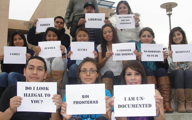 Members+of+STAND+hold+up+signs+meant+to+dispel+Latino+stereotypes.