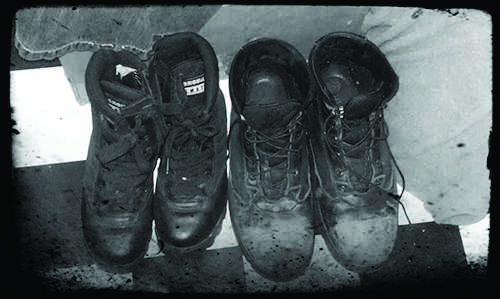 two pairs of combat boots