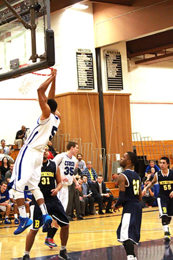Quincy+Lawson+slamming+it+down+for+the+Cougars.+Photo+taken+by+Anne+Hall.