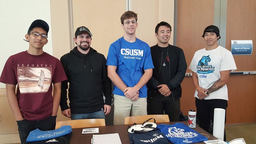 From left to right Justin Acala, David Mosley, Connor Shin, Donovan Lay and Sebastian Ring at a booth representing their wrestling club.