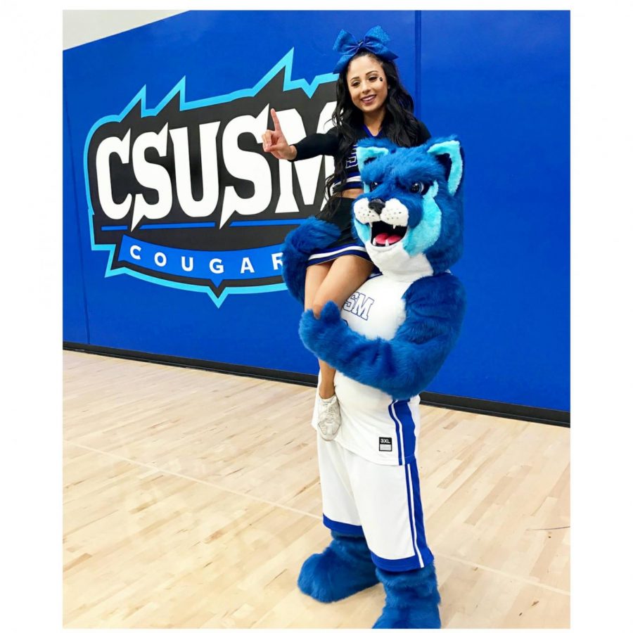 Crash the Cougar in his new look together with cheerleader Tatum Rios.
