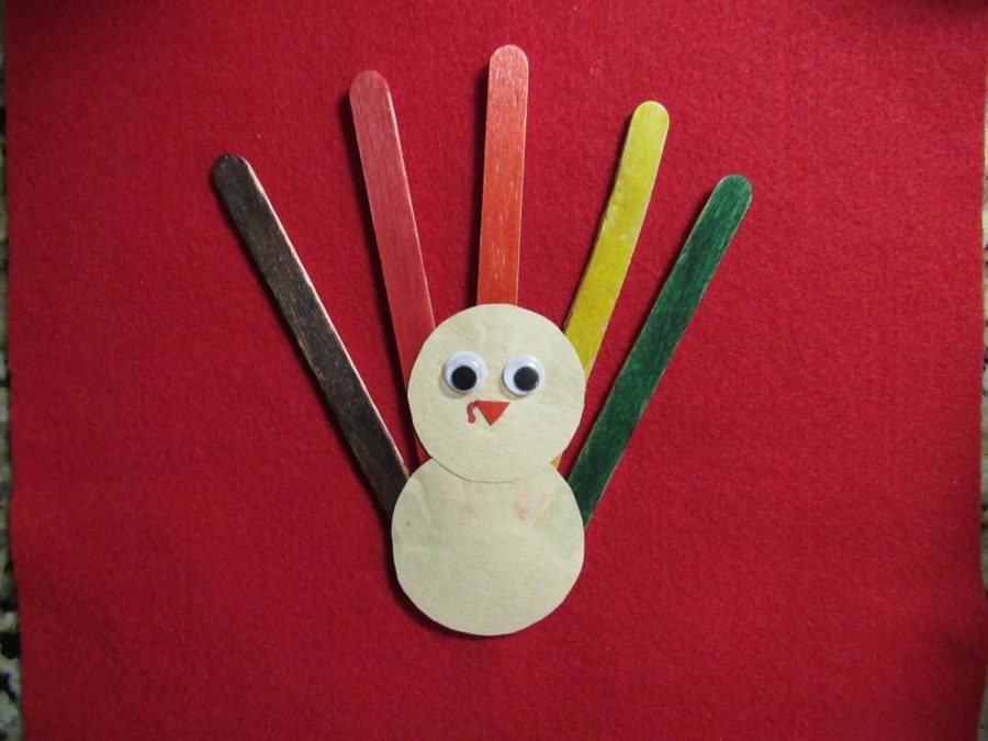 Popsicle stick turkeys are a fun and innovative Thanksgiving craft.