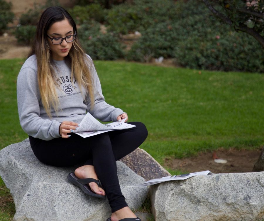 Samantha Carillo is reading one of the articles she’s extra thankful for in The Cougar Chronicle on Thursday, Nov.16.
