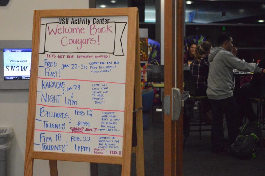  Behind the doors of the USU Activity Center, students participate in a Wednesday Karaoke night, one of the many Welcome-back events held in this room.
