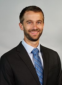 Men’s cross country and track and field head coach Torrey Olson