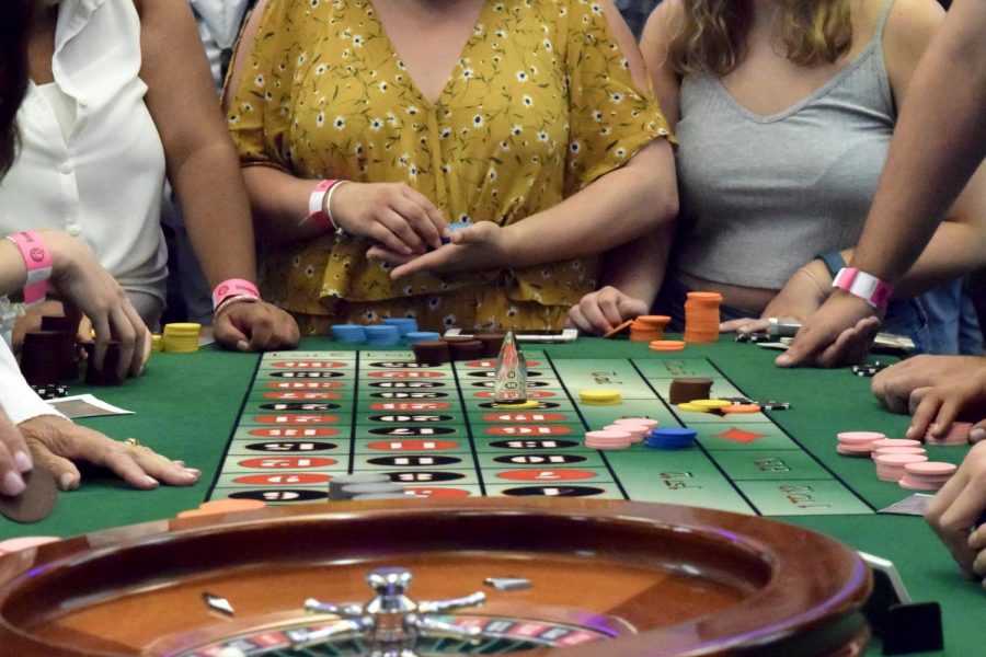 Students place their bets at the roulette table during CSUSMs Casino Night on August 31st.
