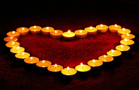 Candles lit as students advocate against domestic violence.