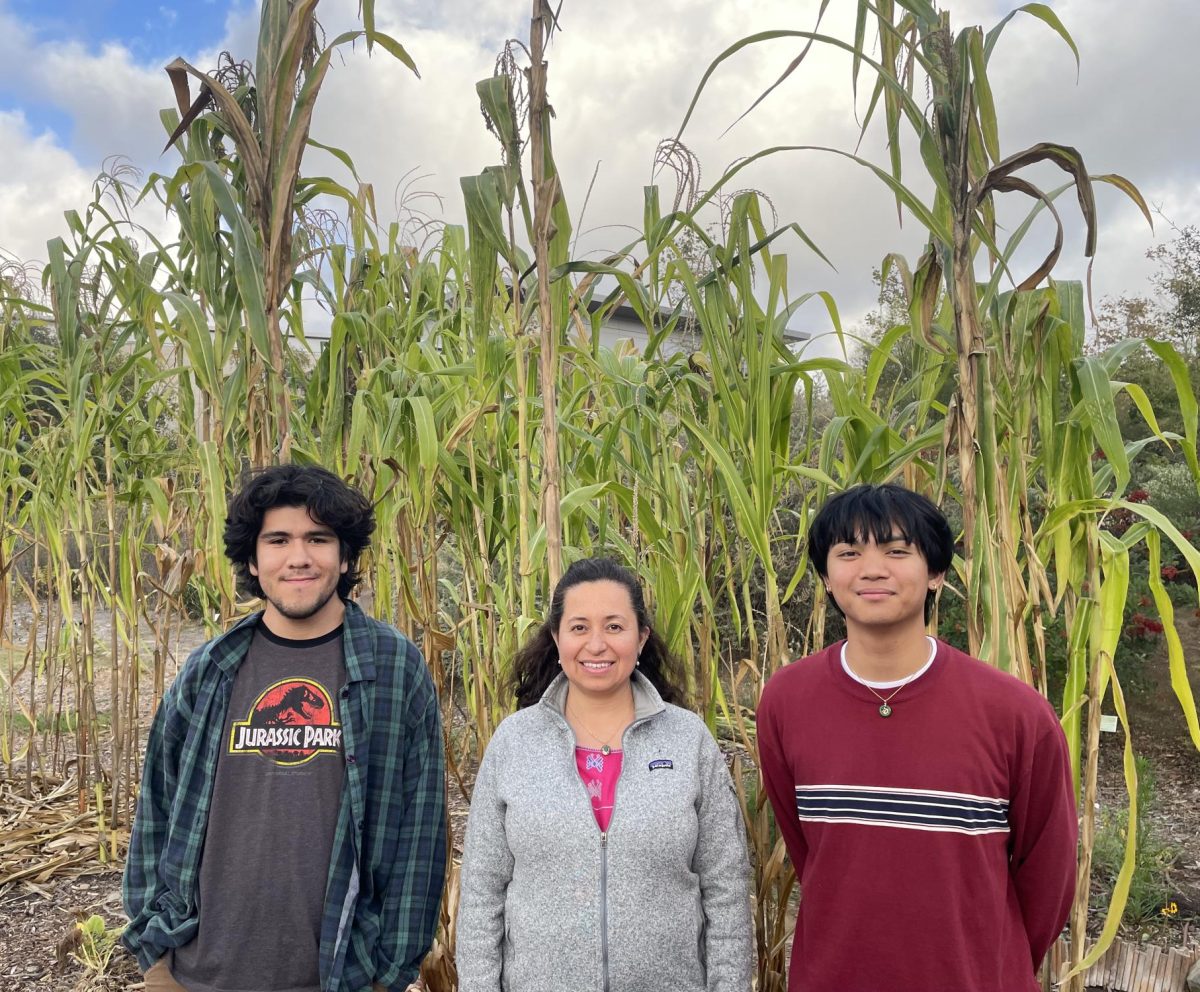 Biology Professor Dr. Erika Diaz Almeyda (center) alongside two of her students, Alexis Rios (left) and Joshua Liberato (right).