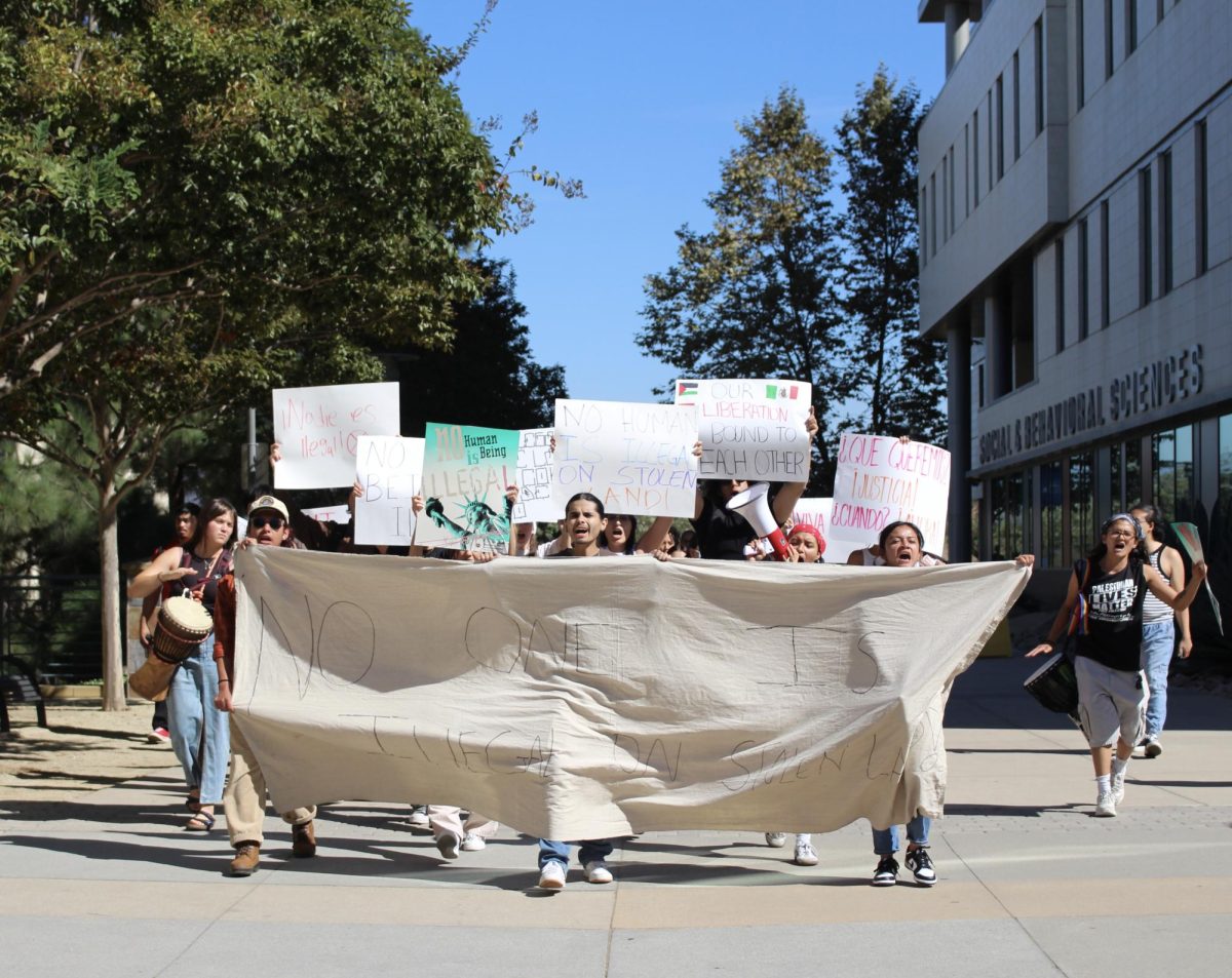 Students protesting outside the Social Behavioral Sciences Building