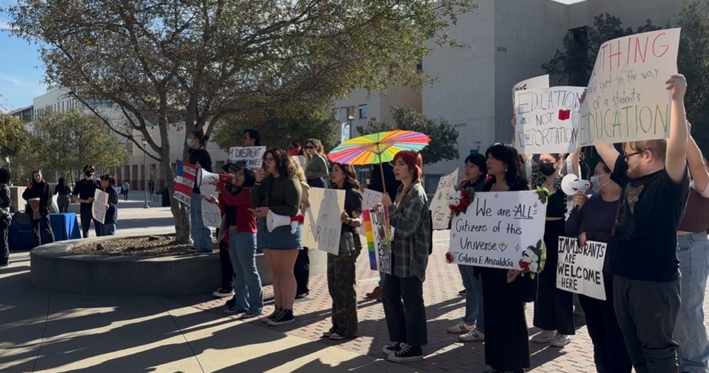 Protesters yelling through their megaphones directly toward the USU where the symposium was held.