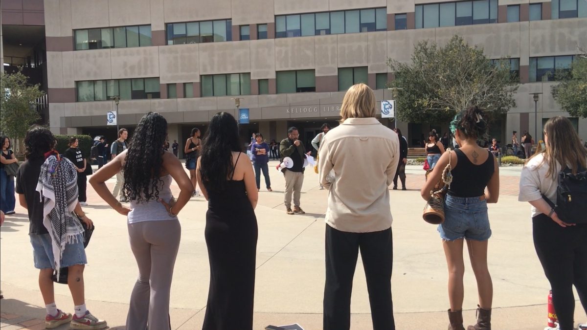 Student activists, joined by faculty, fight for immigrant rights. Center: Jason Magabo Perez 